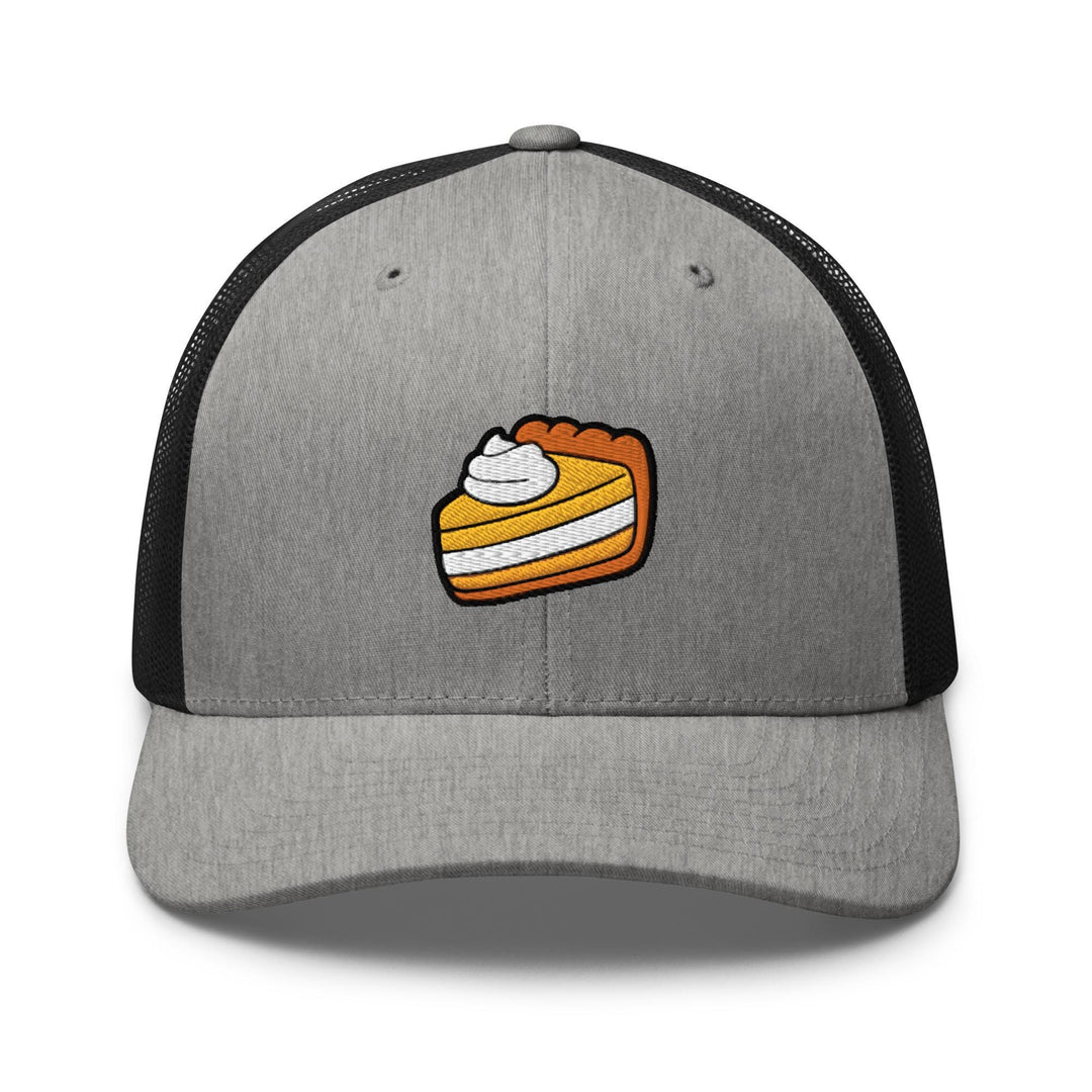 a gray and black hat with a piece of pie on it