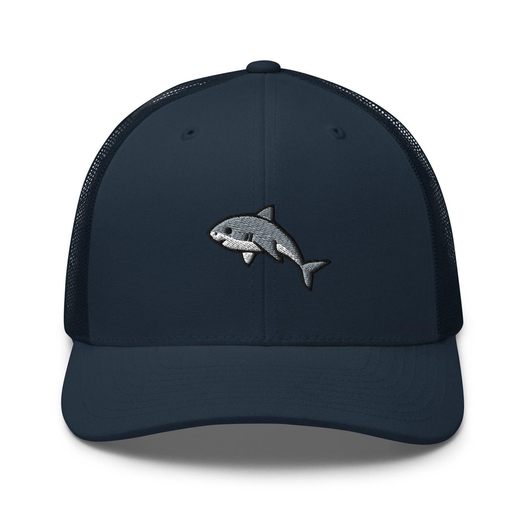 a blue trucker hat with a shark embroidered on the front