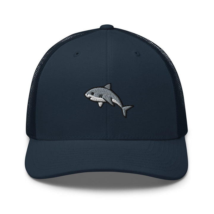 a blue trucker hat with a shark embroidered on the front