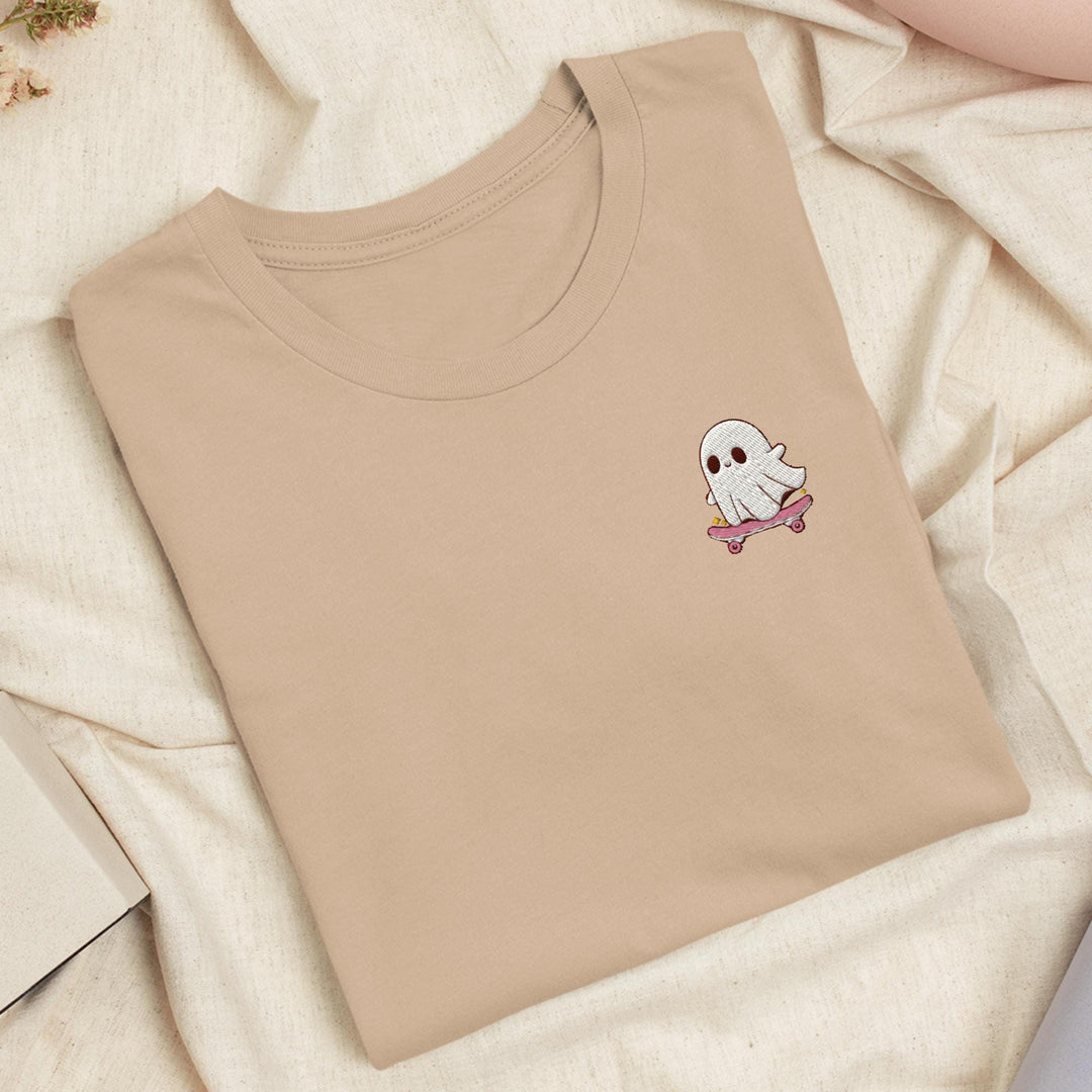 a t - shirt with a ghost embroidered on it