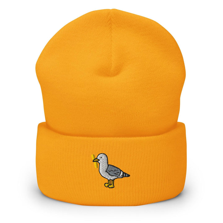 a yellow beanie with a bird on it
