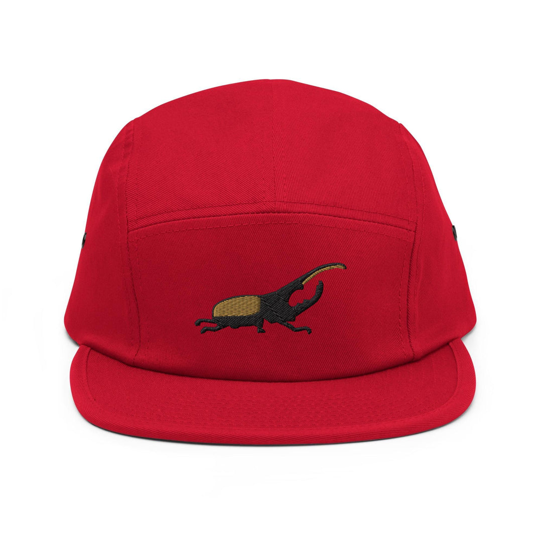 a red hat with a lizard embroidered on it
