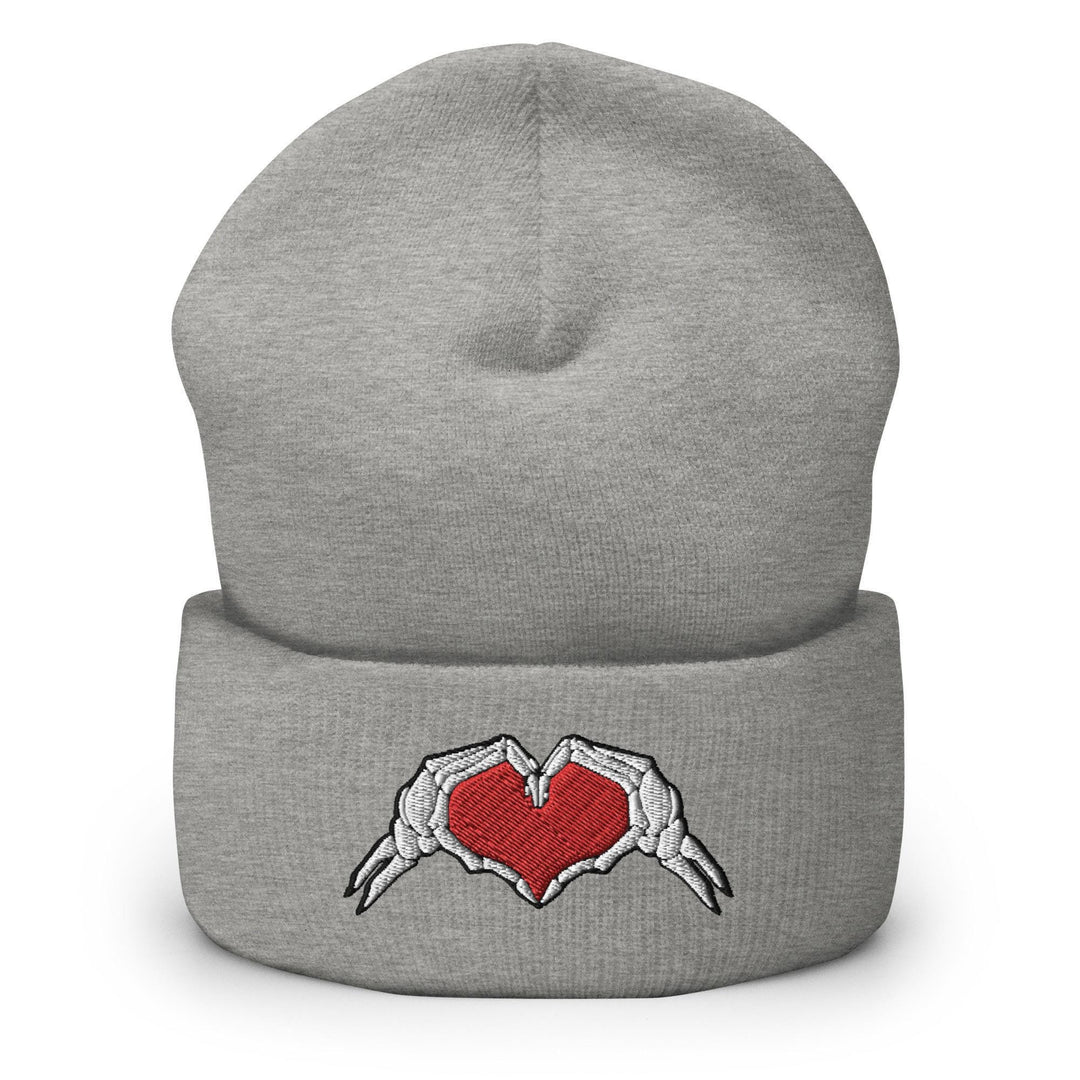 a gray beanie with a red heart on it