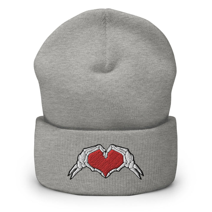 a gray beanie with a red heart on it