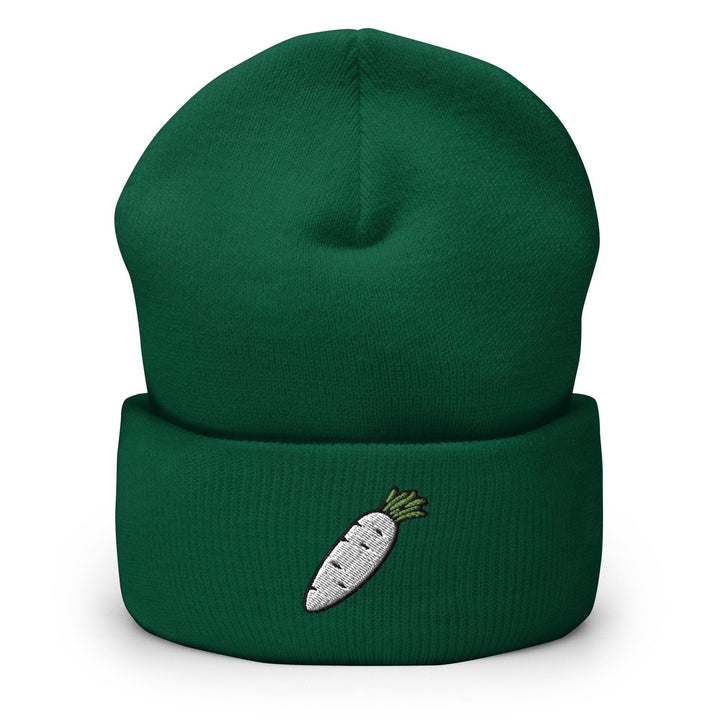 a green beanie with a white carrot embroidered on it