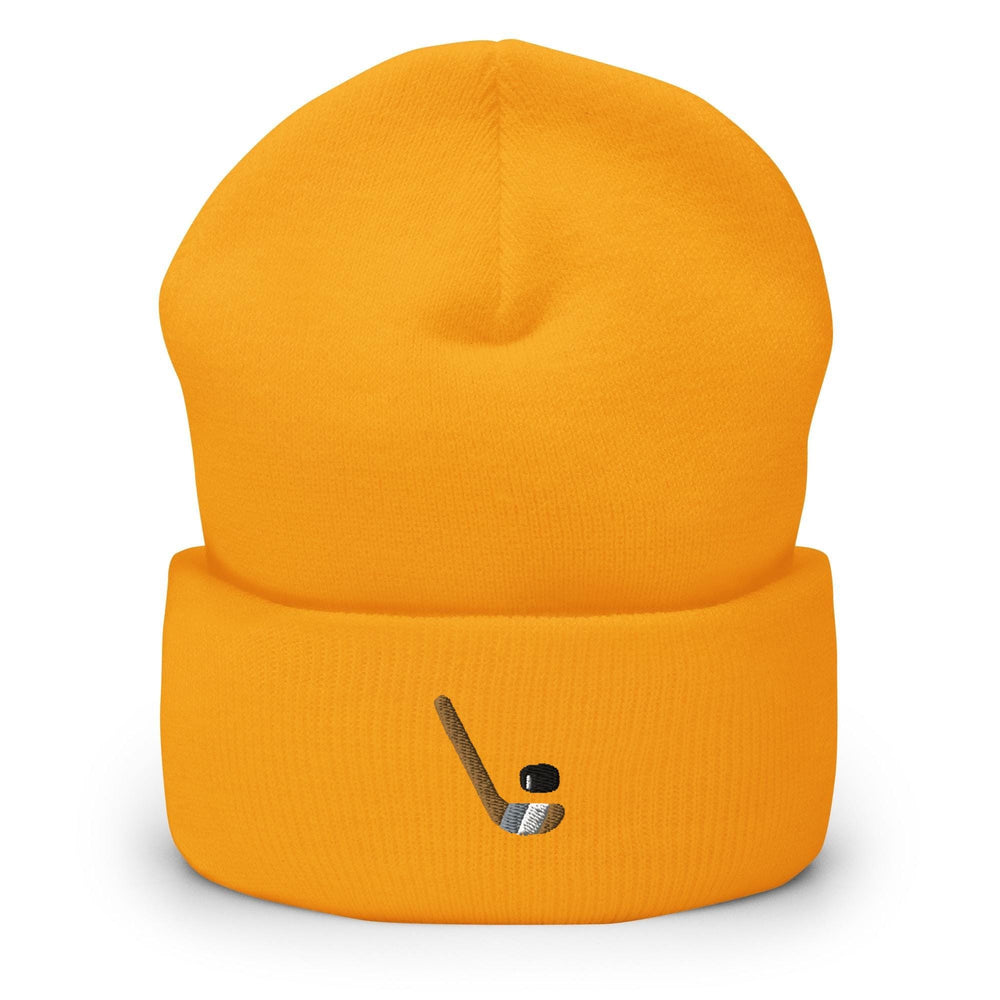 a yellow hat with a hockey stick sticking out of it