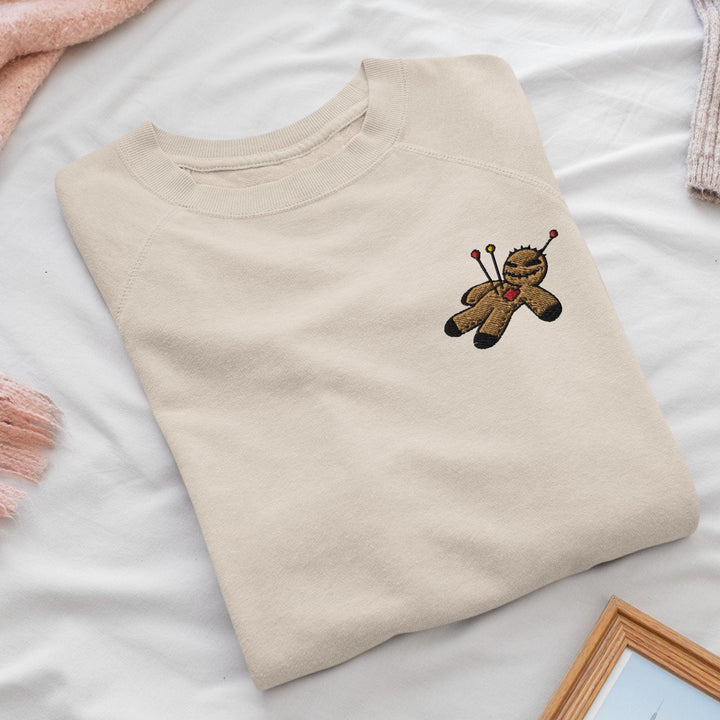 a t - shirt with a teddy bear embroidered on it