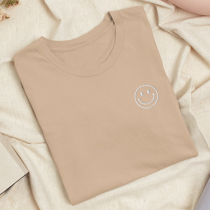 a t - shirt with a smiley face on it