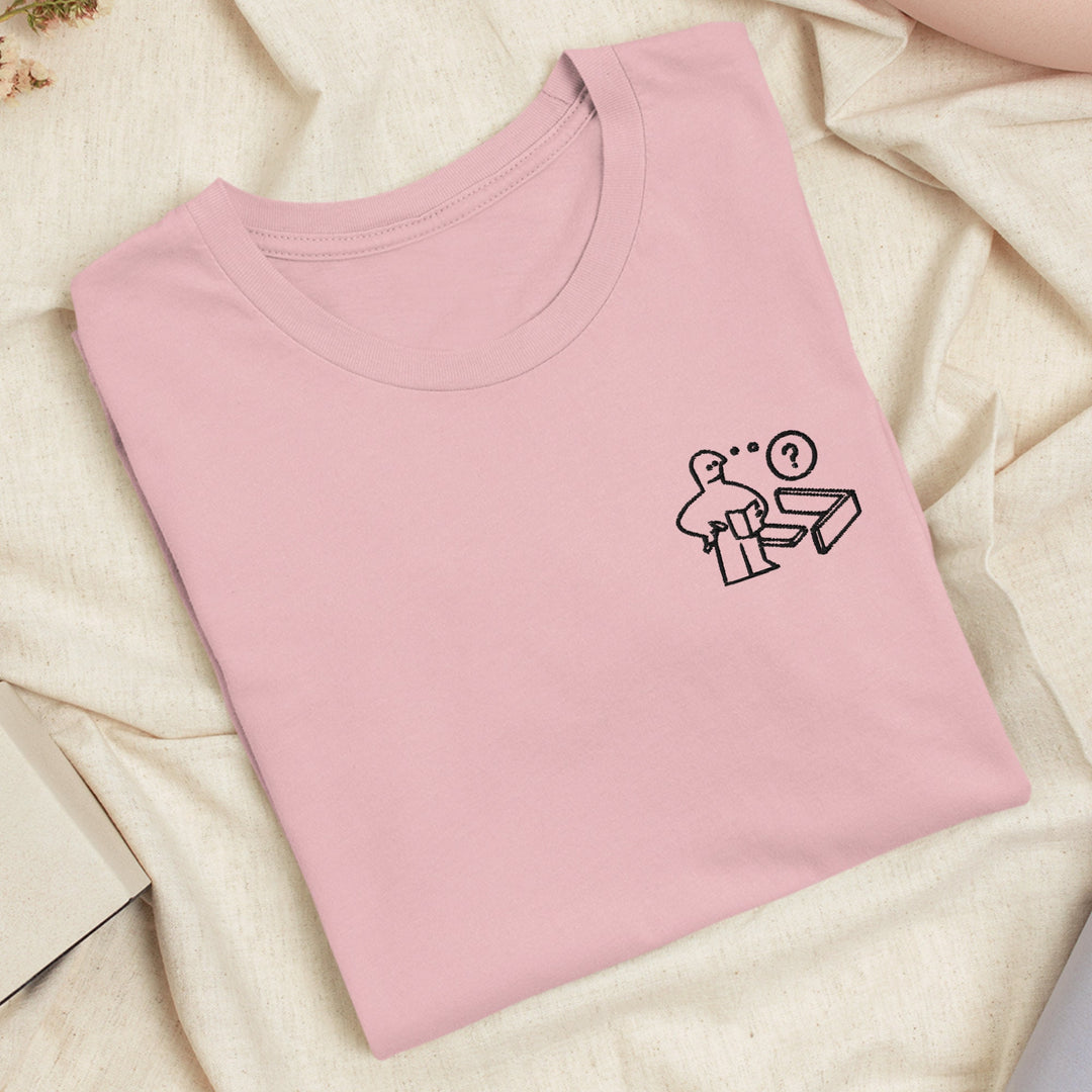a pink t - shirt with a stick figure on it