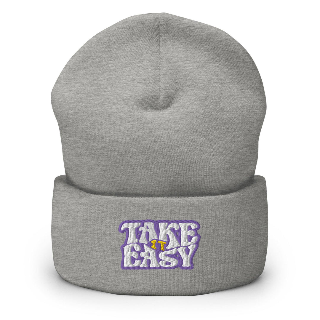 a grey beanie with the words take easy on it