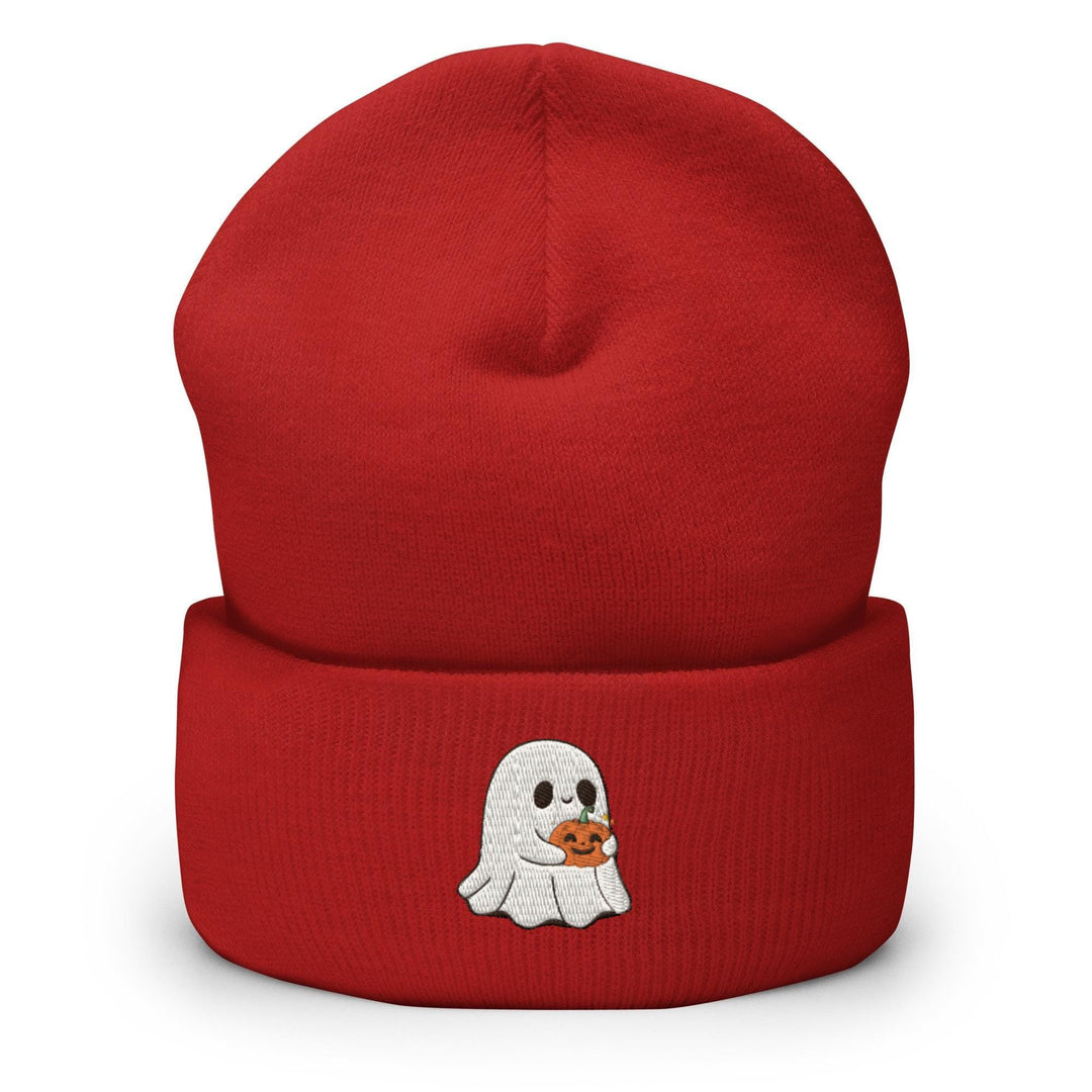 a red beanie with a ghost holding a pumpkin