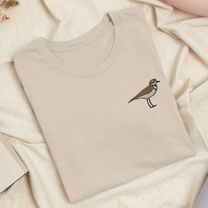 a t - shirt with a bird embroidered on it