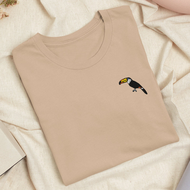 a t - shirt with a bird embroidered on it