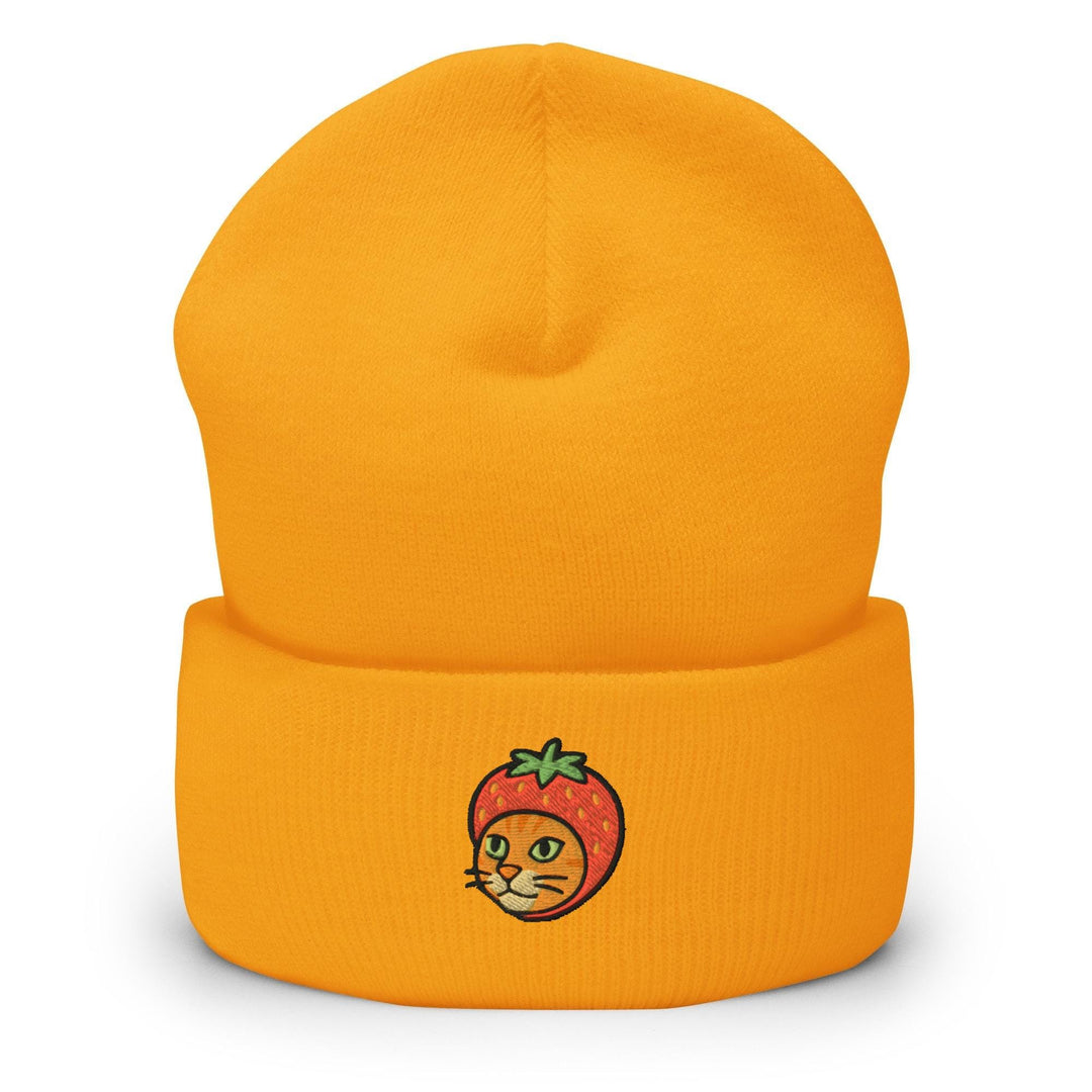 a yellow beanie with a picture of a strawberry on it