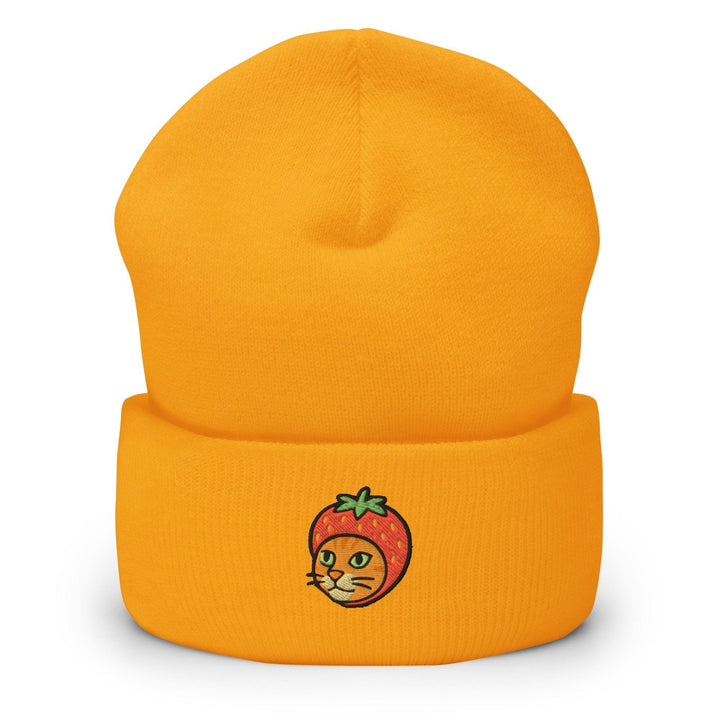 a yellow beanie with a picture of a strawberry on it
