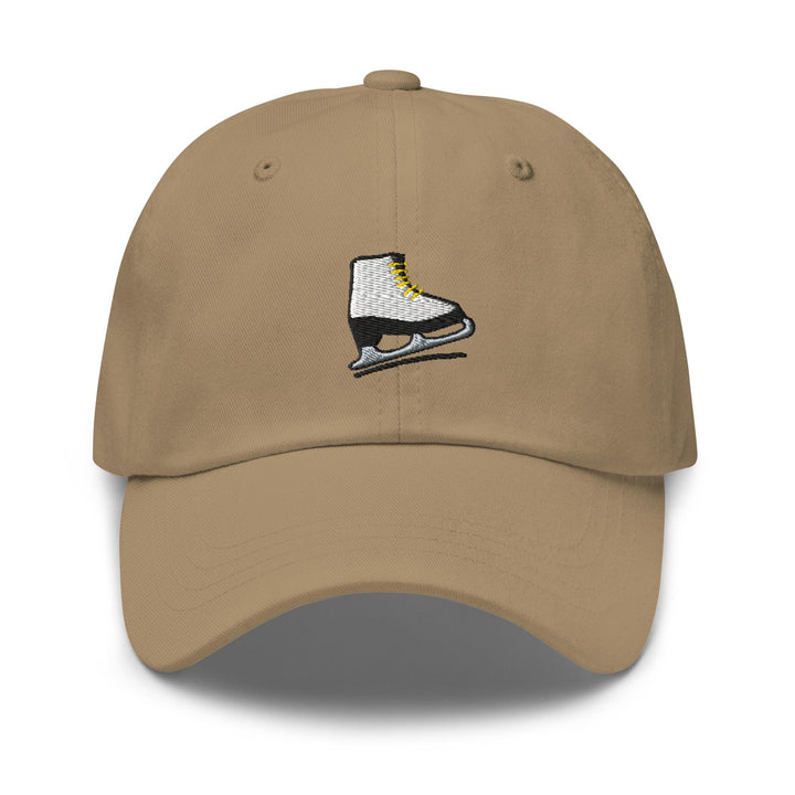 a tan hat with a pair of ice skates embroidered on it