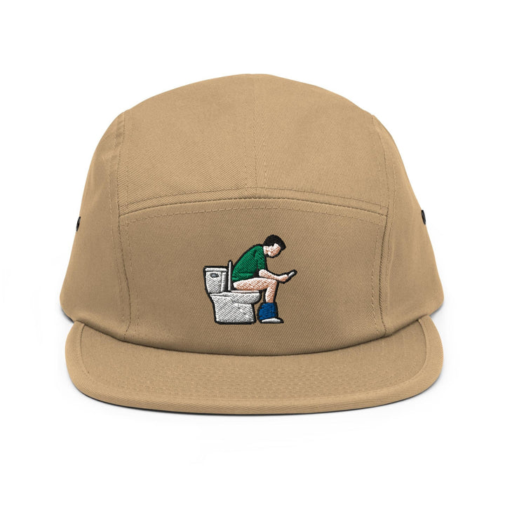 a brown hat with a man sitting on a toilet