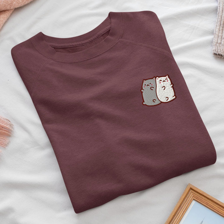 a t - shirt with a picture of two cats on it