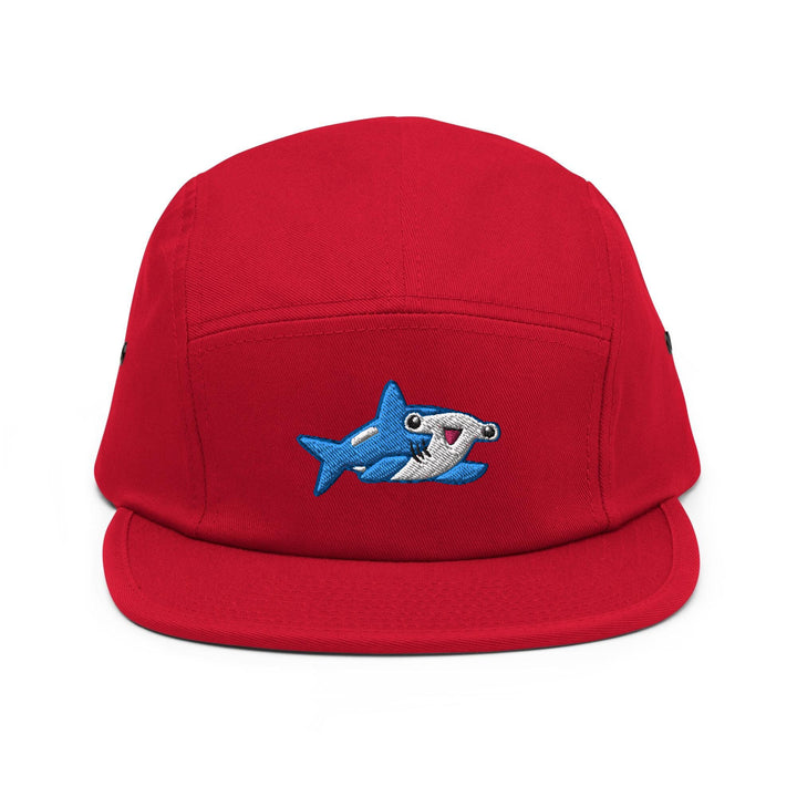 a red hat with a shark embroidered on it