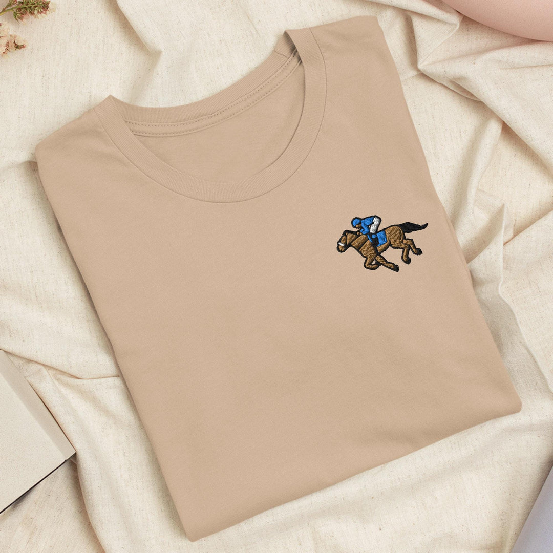 a t - shirt with a horse and jockey on it