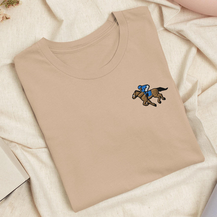 a t - shirt with a horse and jockey on it