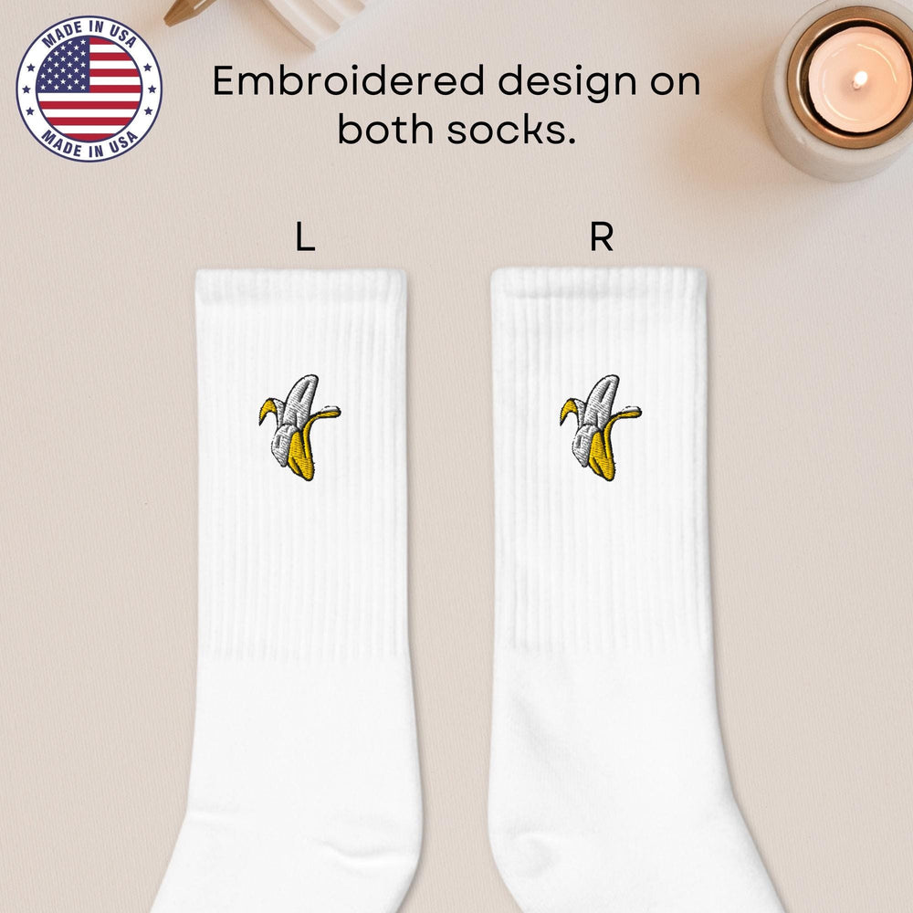 a pair of white socks with a banana on them