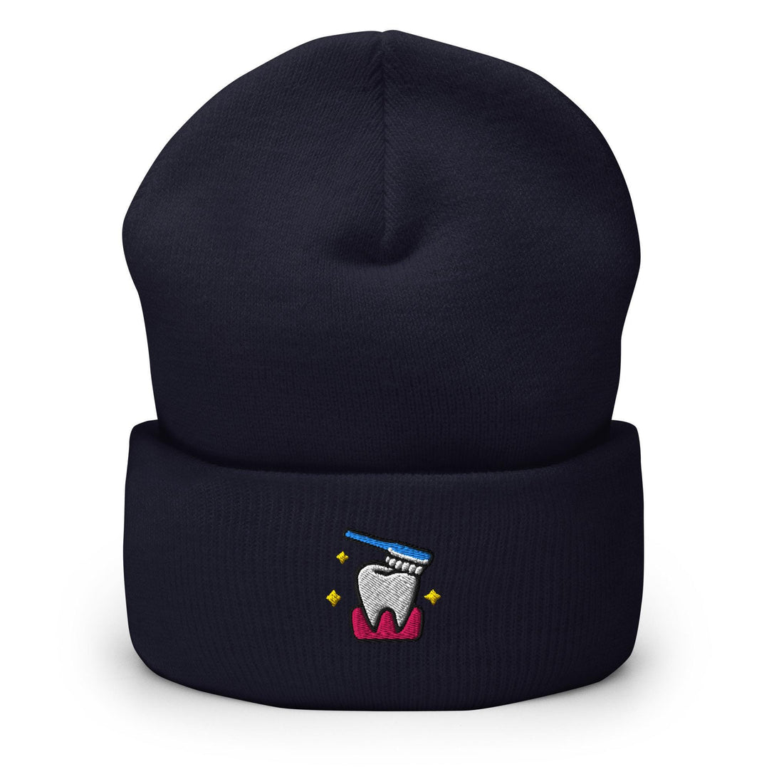 a beanie with a tooth and a toothbrush on it