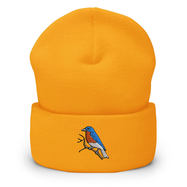a yellow beanie with a bird on it