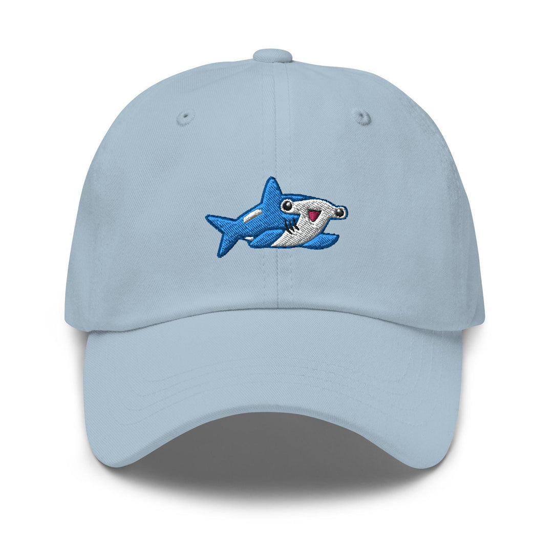 a blue hat with a shark embroidered on it