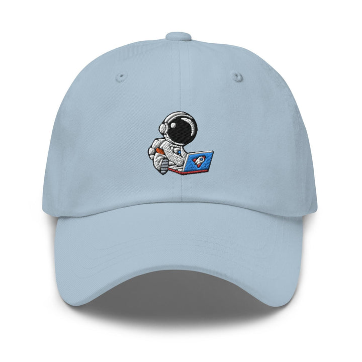 a light blue hat with an astronaut reading a book