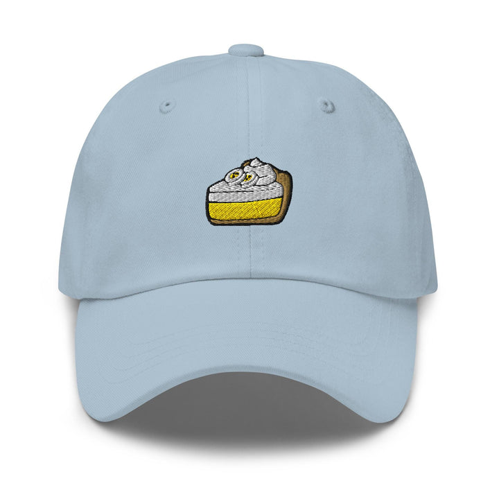 a light blue hat with a piece of cake embroidered on it