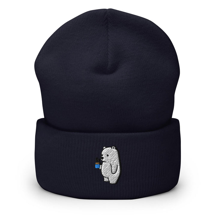 a blue beanie with a white bear on it