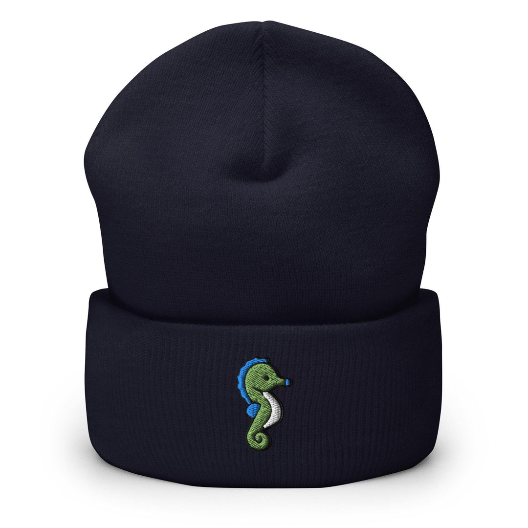 a blue beanie with a green seahorse embroidered on it