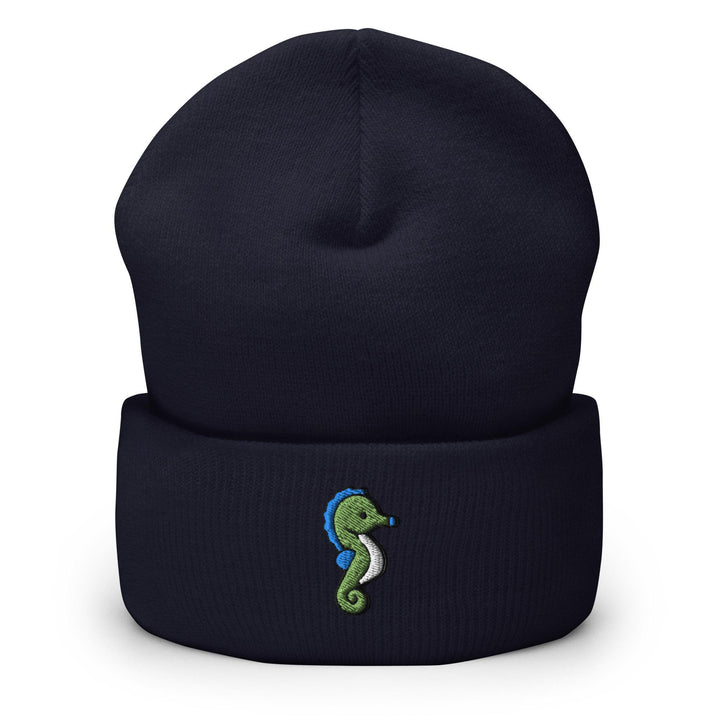 a blue beanie with a green seahorse embroidered on it