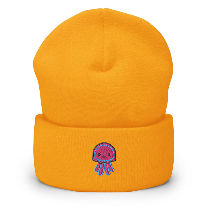 a yellow beanie with a purple octopus on it