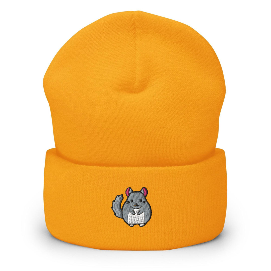 a yellow beanie with a picture of a squirrel on it