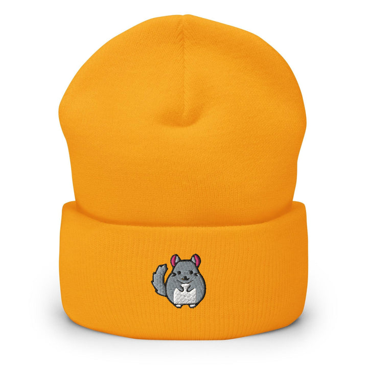 a yellow beanie with a picture of a squirrel on it