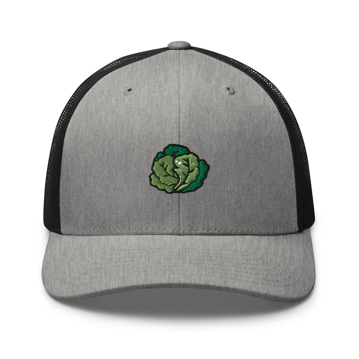 a gray and black trucker hat with a green head