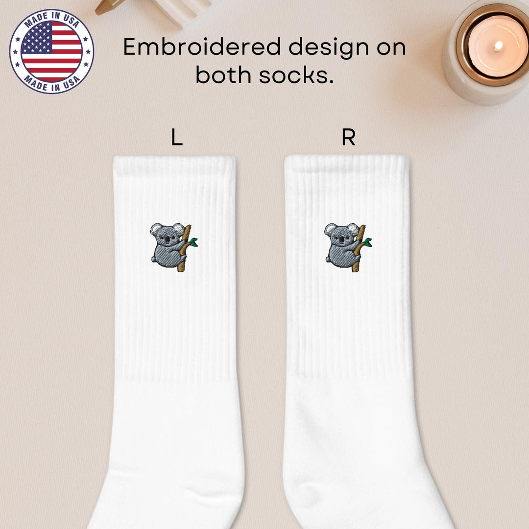 a pair of socks with a koala on them