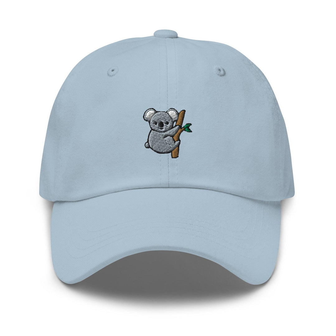 a light blue hat with a koala on it
