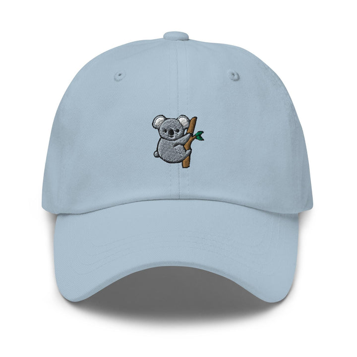 a light blue hat with a koala on it