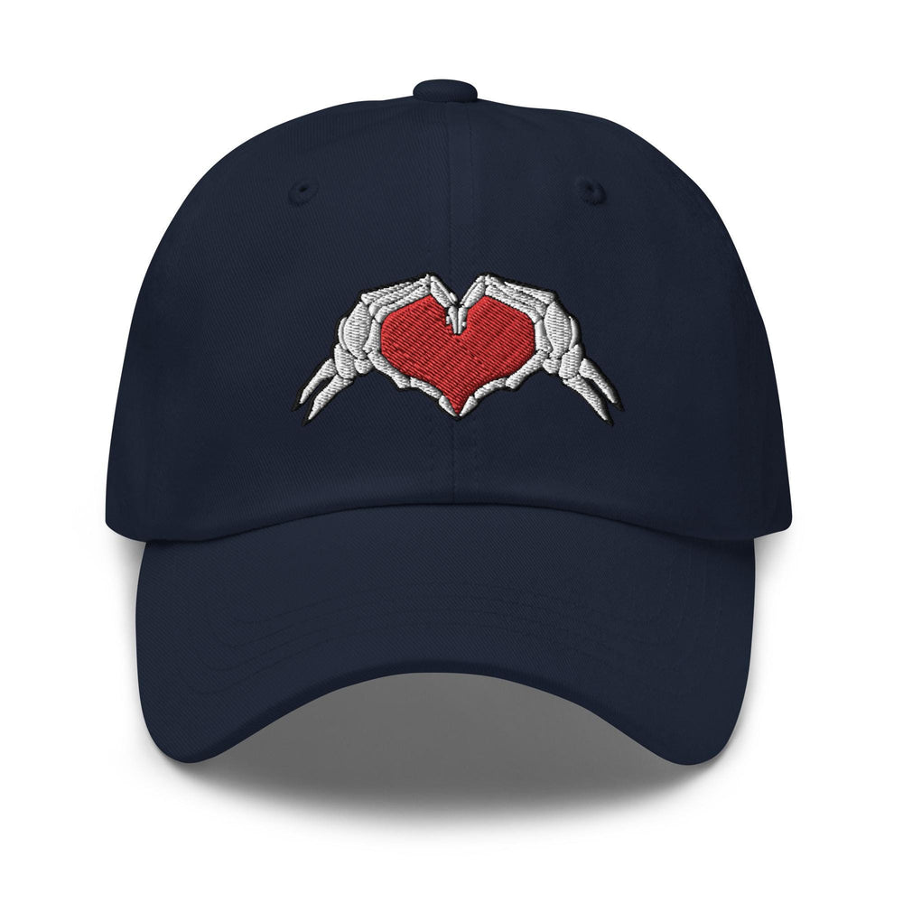 a baseball cap with two hands holding a heart