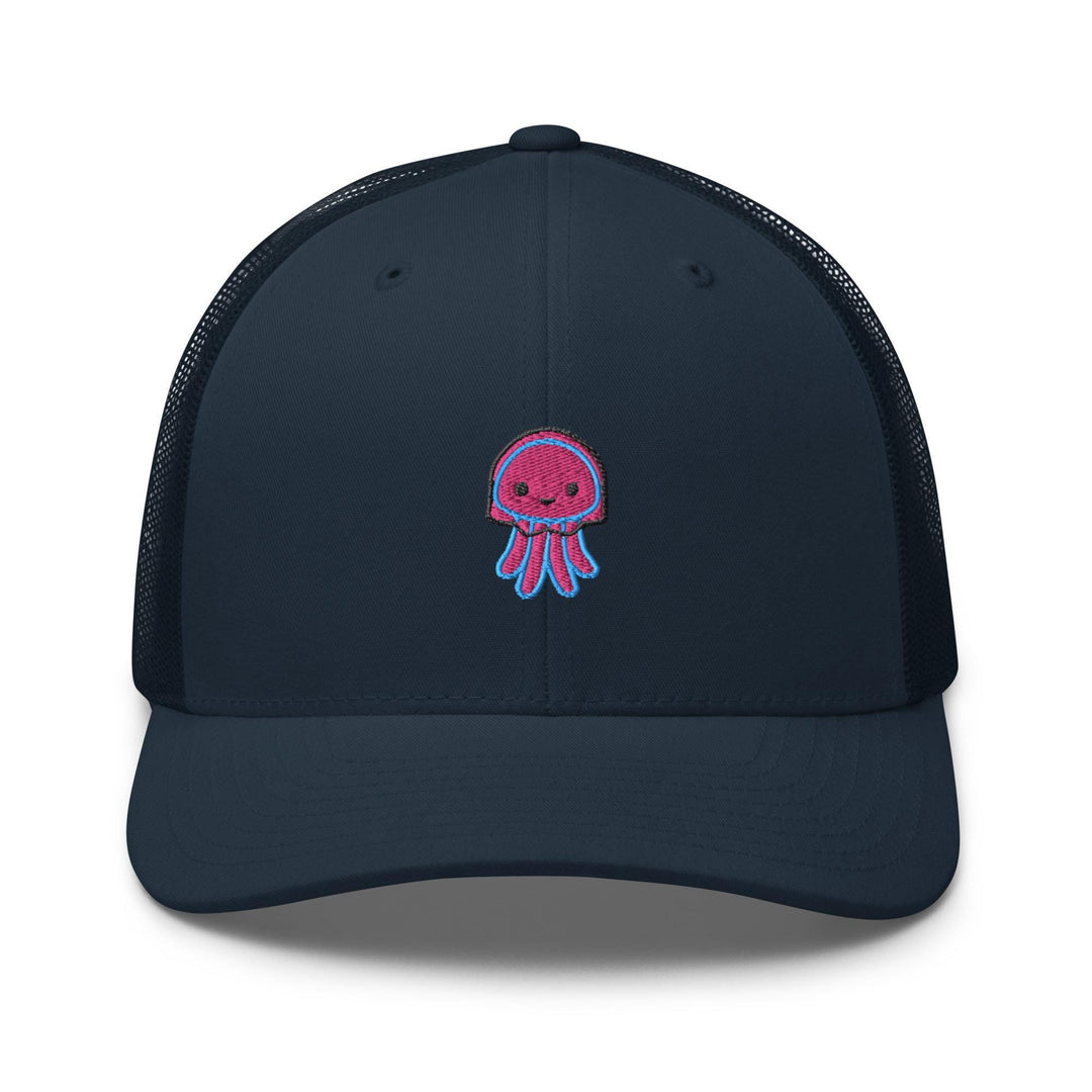 a blue trucker hat with a pink jellyfish embroidered on the front