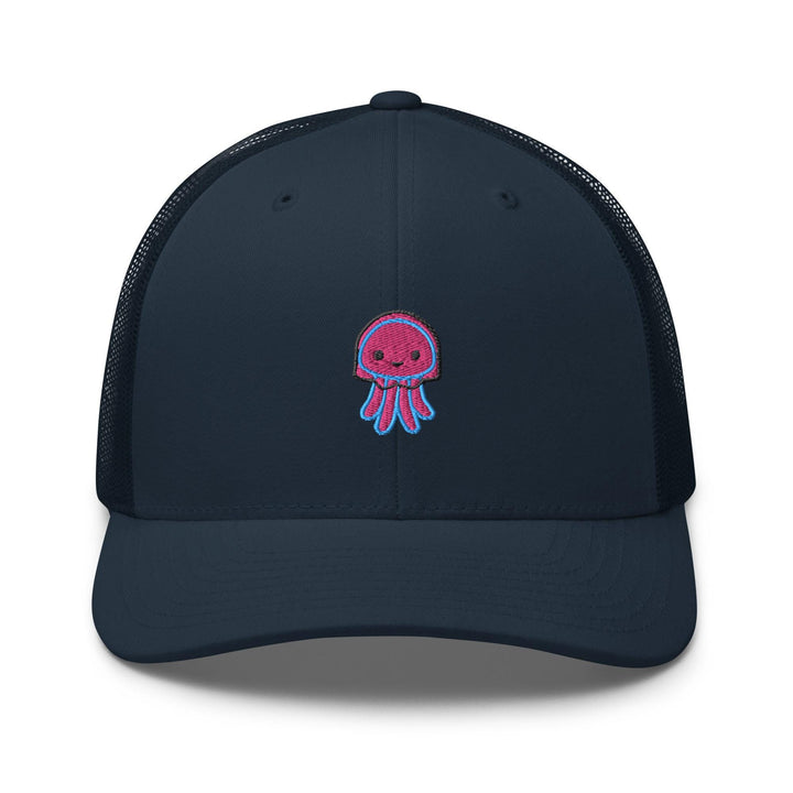 a blue trucker hat with a pink jellyfish embroidered on the front