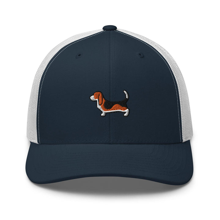 a blue and white trucker hat with a dog embroidered on the front