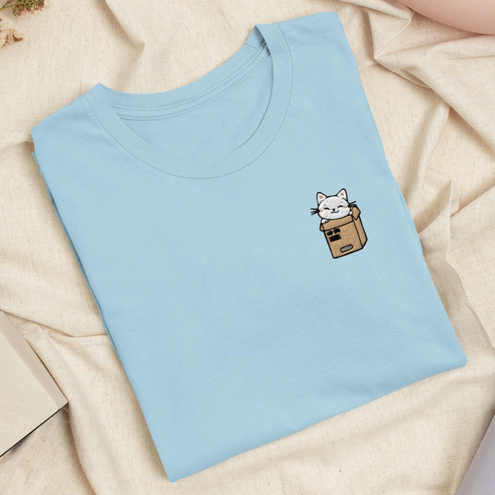 a blue shirt with a cat in a box on it