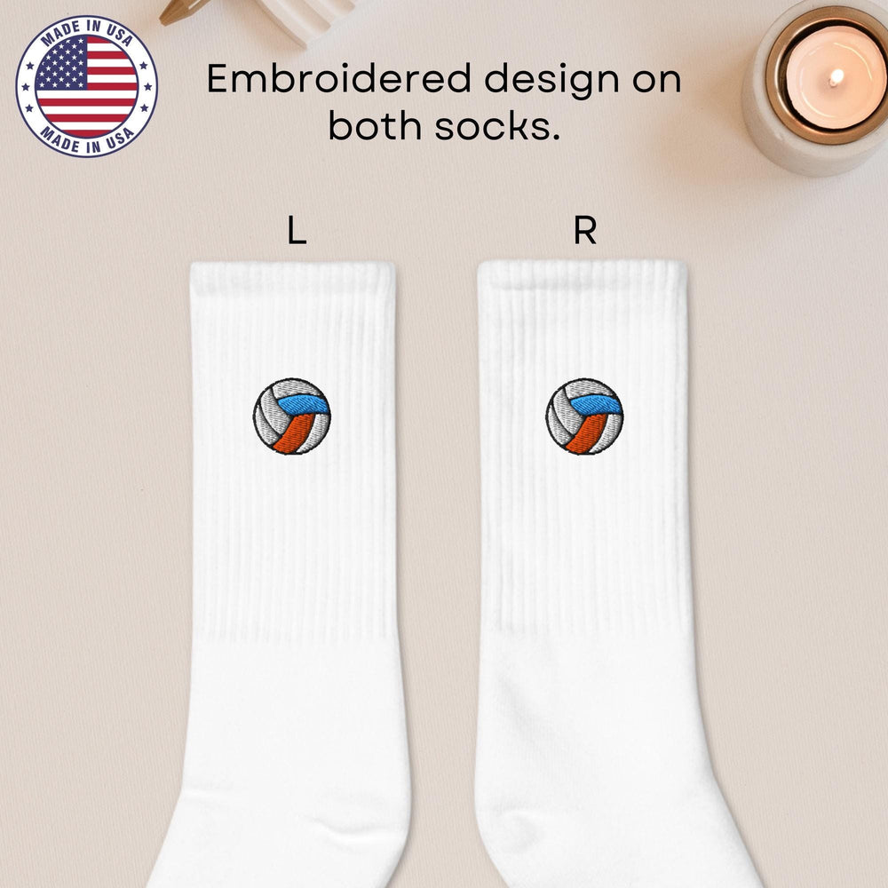 a pair of white socks with a volleyball ball on them