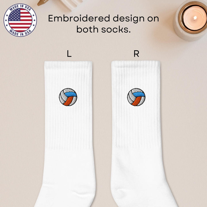a pair of white socks with a volleyball ball on them