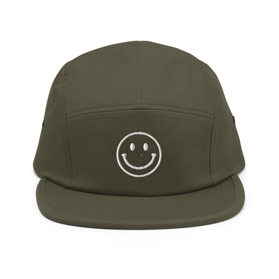 a green hat with a smiley face drawn on it