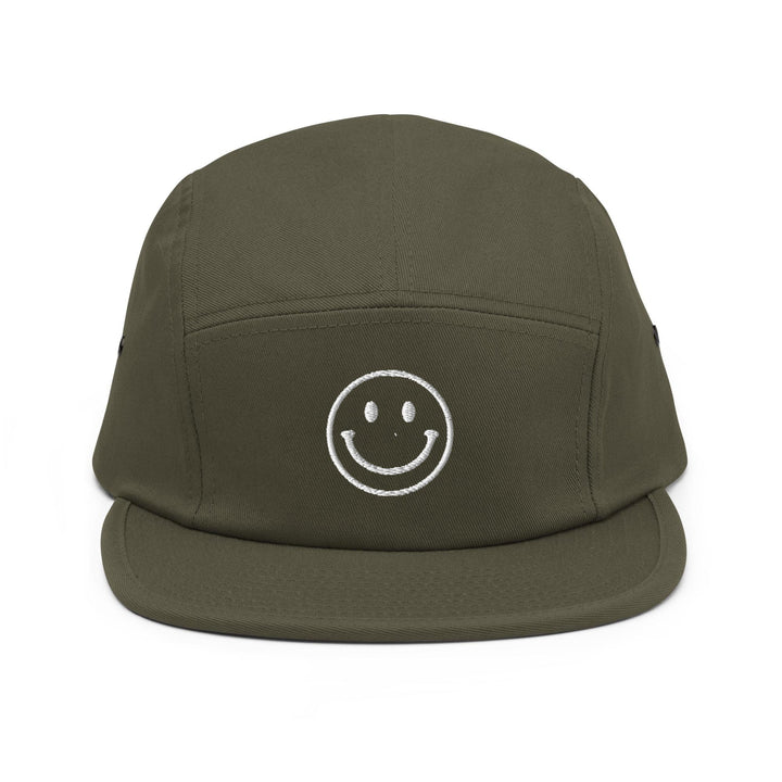 a green hat with a smiley face drawn on it